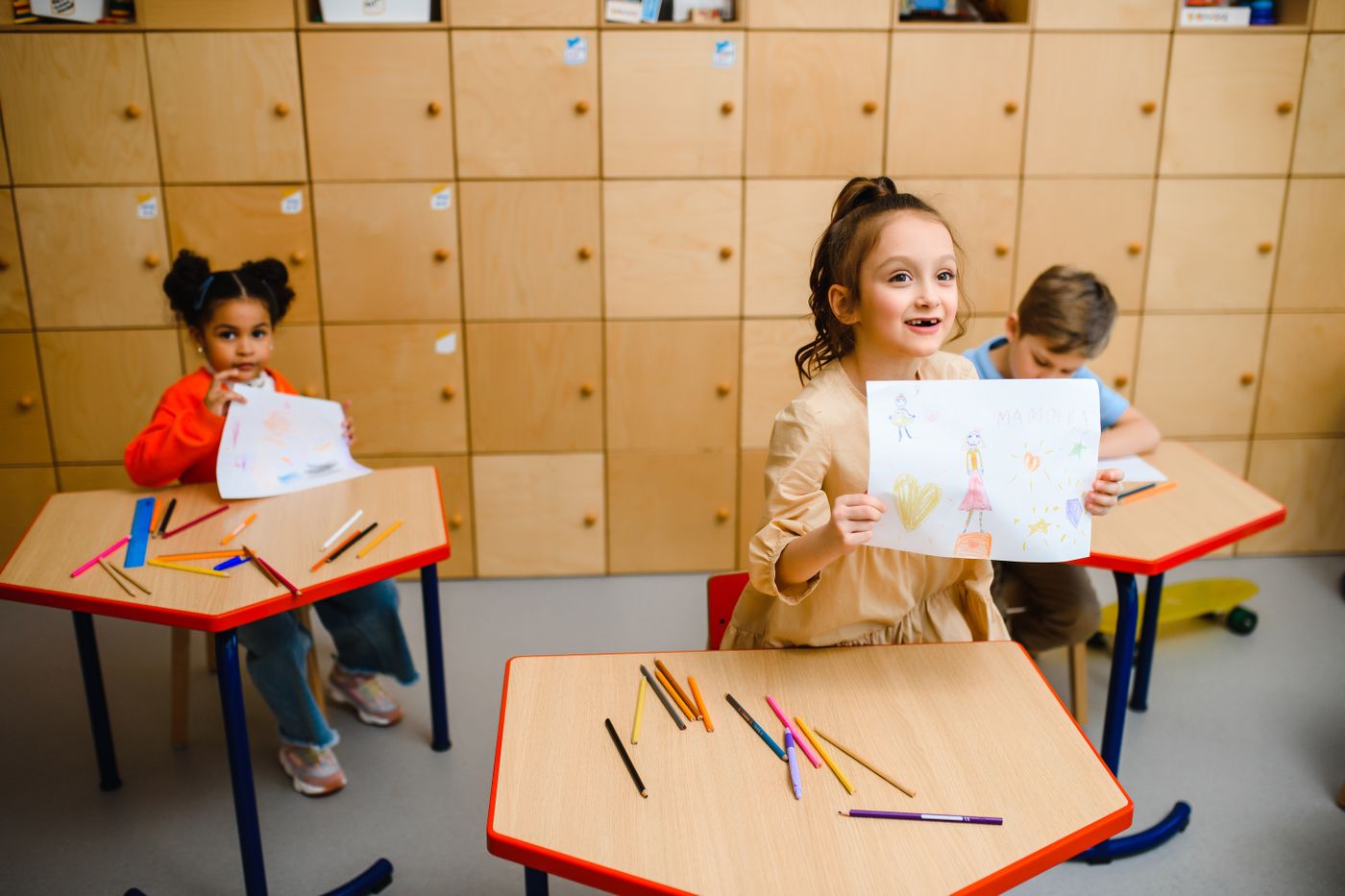 Kids showing their art creations