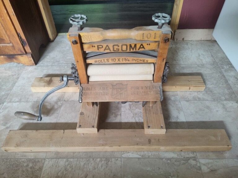 Antique Pagoma Wringer Vintage Retreat Detail Historic Pagoma hand-crank clothes wringer machine adding vintage charm to the retreat.