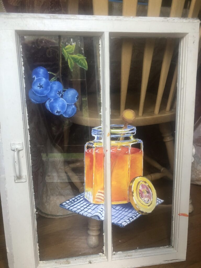 Blueberry & Honey Jar Window Painting Painted glass window with blueberries and honey jar, handmade folk art at the retreat.