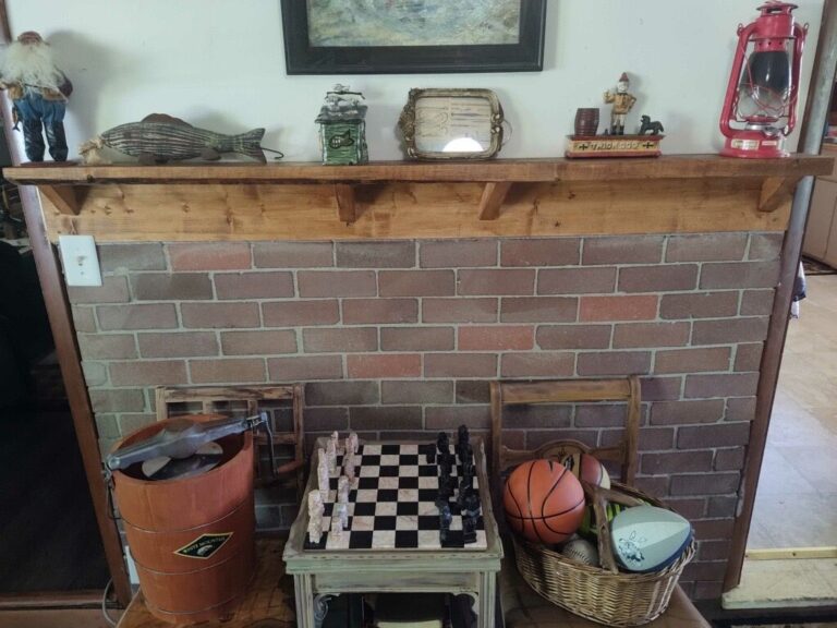 Rustic Fireplace Fishing Decor Retreat Missouri Rustic brick fireplace with vintage fishing and outdoor collectibles at the Missouri retreat.