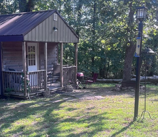 Rustic Retreat Cabin Montauk Missouri Charming rustic cabin exterior surrounded by lush Missouri forest.