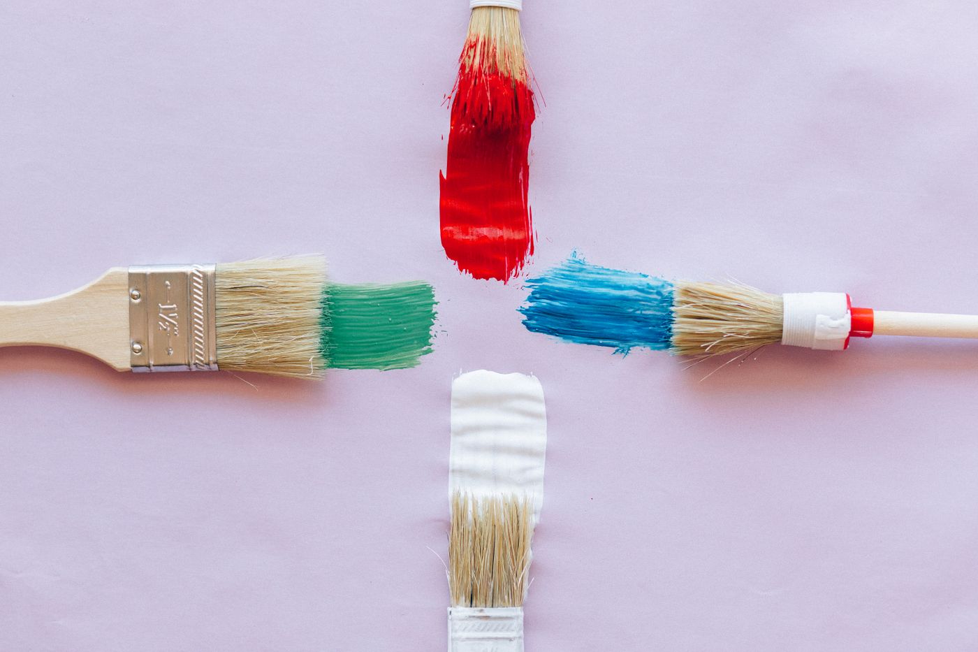 Paint brushes with colorful strokes